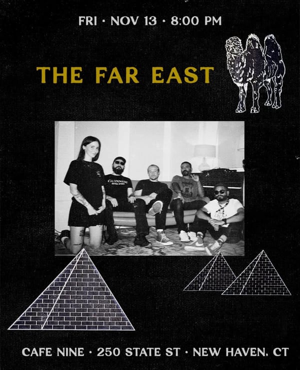 Five people pose for a band poster in a dimly lit room.