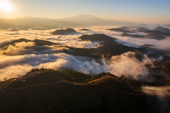 Landscape of Morning Mist with Mountain Layer. mountain ridge and clouds in rural jungle bush forest