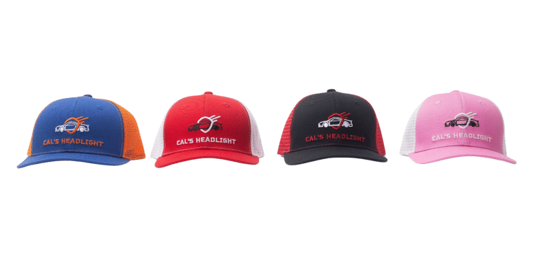 Four branded trucker caps in different colors displayed against a black background.