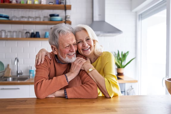 Portrait of Senior Couple in Kitchen Looking at Camera