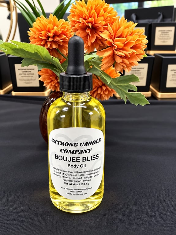 A clear glass bottle of body oil with a black dropper cap.